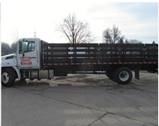 An Ashmore Rentals stake truck ready for rent